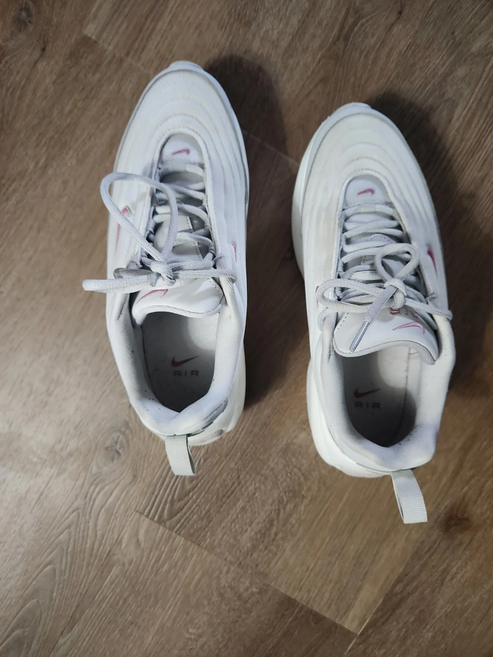 Nike White Sneakers with Pink Swoosh Accents